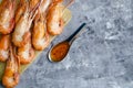 Huge boiled delicious king shrimps on a gray background close-up, copy space, flat lay