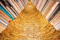 Huge bookworm tower built from old novels and volums of historical library. Big installation with many vintage books Royalty Free Stock Photo