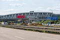 Huge Bosch letters at the Stuttgart Airport parking garage with empty highway A8 and construction works in the Royalty Free Stock Photo