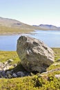 Huge boulder, big rock Vavatn lake in Hemsedal, Buskerud, Norway Royalty Free Stock Photo