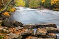 Huge boulders and colorful fall forest on a riverside Royalty Free Stock Photo