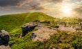 Huge boulders on the edge of hillside at sunset Royalty Free Stock Photo