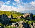 Huge boulders on a grassy hillside at sunrise Royalty Free Stock Photo