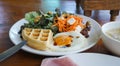 huge breakfast with selective focus on center plate. Southern cuisine breakfast with waffles