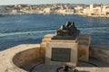 Valletta, Malta, August 2019. Monument to the fallen defenders of the island and the bay is visible. Royalty Free Stock Photo