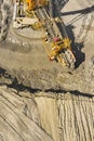 Huge bucket wheel excavator or mobile strip mining machine mining coal in a quarry. Heavy industry concept Royalty Free Stock Photo