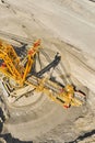 Huge bucket wheel excavator or mobile strip mining machine mining coal in a quarry. Heavy industry concept Royalty Free Stock Photo