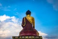 Huge buddha golden statue from different perspective with bright blue sky at evening Royalty Free Stock Photo