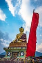 Huge buddha golden statue from different perspective with bright blue sky at evening Royalty Free Stock Photo