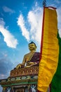 Huge buddha golden statue from different perspective with bright blue sky at evening Royalty Free Stock Photo