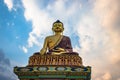 Huge buddha golden statue from different perspective with bright blue sky at evening Royalty Free Stock Photo