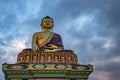 Huge buddha golden statue from different perspective with moody sky at evening Royalty Free Stock Photo