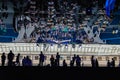 A huge building with a mirrored ceiling and a balcony with people standing on it. Futuristic forum in Moscow. Moscow Royalty Free Stock Photo