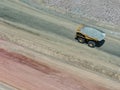Huge CAEX mining truck in the process of transporting gold and silver ores to a mineral processing plant Royalty Free Stock Photo