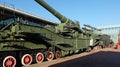 A huge cannon on a railway platform.