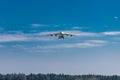 Huge cargo plane is approaching the runway and is about to land on an airport in Ljubljana, Slovenia. Freighter jet descending Royalty Free Stock Photo