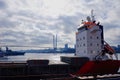 Huge cargo ship in the sea in Vladivostok with cloudy sky on the horizon