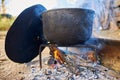 Huge cast iron pot boiling water Royalty Free Stock Photo