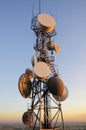 Huge cell phone satellite tower at sunset Royalty Free Stock Photo
