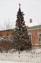 Huge Christmas tree with bright decoration in a city square Royalty Free Stock Photo