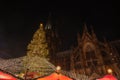 Huge Christmas tree and Cologne Cathedral during Weihnachtsmarkt, Christmas Market in KÃÂ¶ln, Germany.