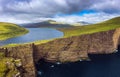 Huge cliff and lake Sorvagsvatn on island of Vagar, Faroe Islands, Denmark. Royalty Free Stock Photo