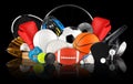 Huge collection stack of sport balls gear equipment from various sports concept dark black background