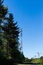 Huge communication antenna tower and satellite dishes against blue sky.Telecommunications tower cells for mobile Royalty Free Stock Photo