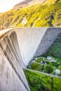 Huge concrete apline dam on sunny summer day