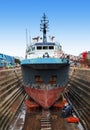 Huge container cargo ship moored to a wharf.