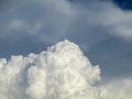 A huge contrasting cumulus rain cloud, similar to a mountain