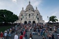 Huge crowd gather on the stairs in front of The Basilica of Sacre Coeur de Montmartre