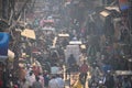 Huge crowd of people walking down the road.