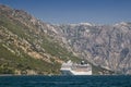 Huge cruise liner ship in port of Kotor city, Montenegro Royalty Free Stock Photo