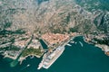 Huge cruise ship is moored in the port of the town of Kotor. Montenegro. Drone Royalty Free Stock Photo