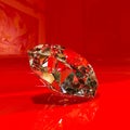 Huge diamond on a red glossy expositor Royalty Free Stock Photo