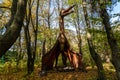 Huge dinosaur model in the forest. Dinosaur in the jungle Royalty Free Stock Photo