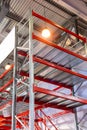 Huge distribution warehouse with high shelves and loaders. Bottom view Royalty Free Stock Photo