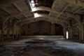 The huge empty abandoned ruined building with a triangular ceiling