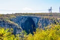 Huge entrance of Bulgarian cave, electric poles