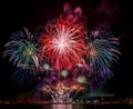 Huge Epic fireworks over lake water display for holiday celebration with Seattle skyline in background Royalty Free Stock Photo