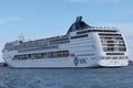 Huge ferry cruising in Venezian lagoon, Italy. Tourists on roof top