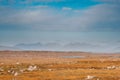 Huge fields and mountains in the background. Blue cloudy sky. Landscape scene in Connemara, county Galway, Ireland. Nobody. Warm