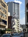 A huge figure of a cat in the cityscape in Tel Aviv