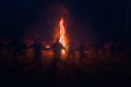 Huge fire at night and young people around. Royalty Free Stock Photo