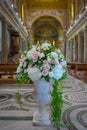 A huge floral composition of white roses, pink roses and green leaves. Wedding decoration in church, dominate white color and lux Royalty Free Stock Photo