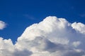 Huge fluffy cumulus cloud on blue sky. Formation before thunderstorm Royalty Free Stock Photo