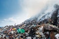 Huge garbage dump area view full of smoke, litter, plastic bottles,rubbish and other trash at the Thilafushi island