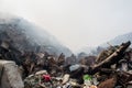 Huge garbage dump mountains view full of litter, plastic bottles,rubbish and other trash at the Thilafushi tropical island Royalty Free Stock Photo