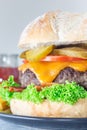 Huge giant homemade cheeseburger for burger party, closeup vertical Royalty Free Stock Photo